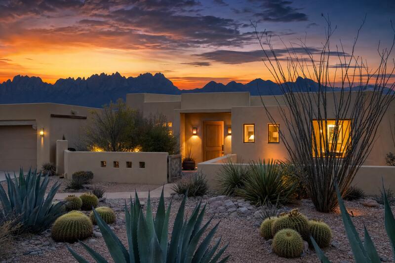Southwestern home at twilight with glowing windows