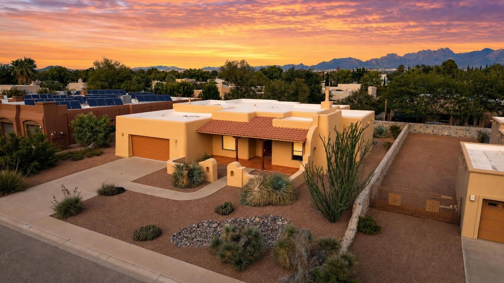 Southwest style home at sunset in Las Cruces, New Mexico, with the Organ Mountains behind it